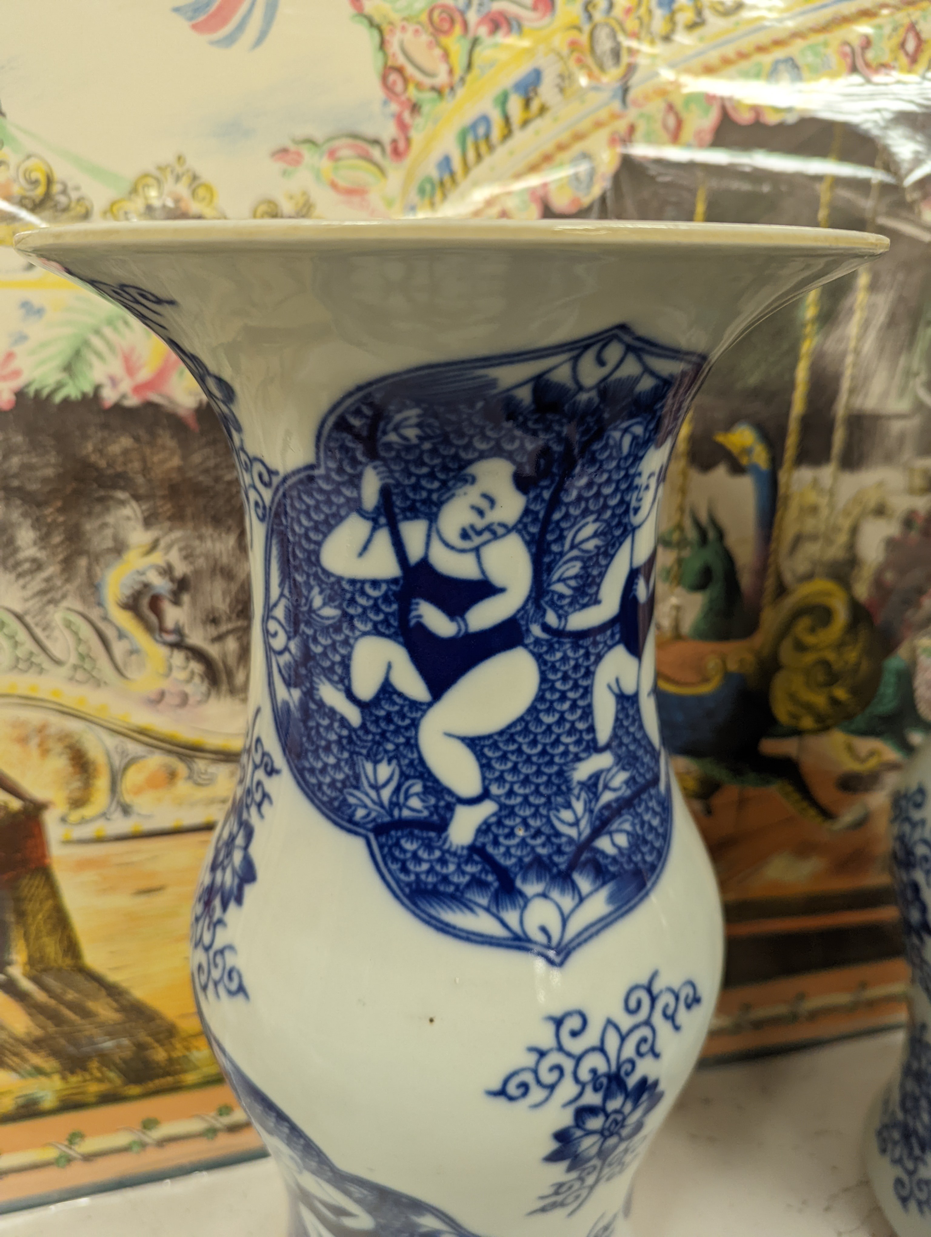 A pair of Chinese blue and white vases on stands and 6 further wood stands. Vases 35cm